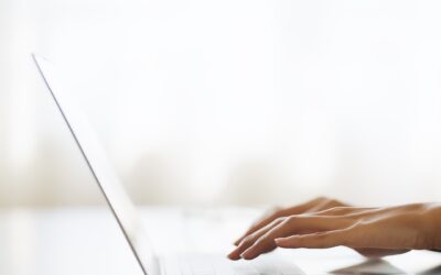 Hand Of Woman Typing On Computer Laptop Keyboard At House