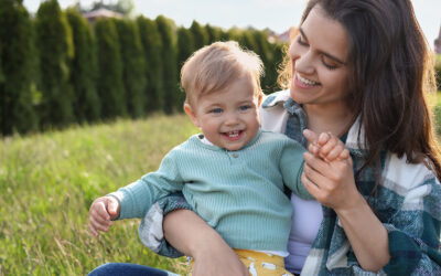 Happy Mother With Her Cute Baby At Backyard On Sunny Day, Space